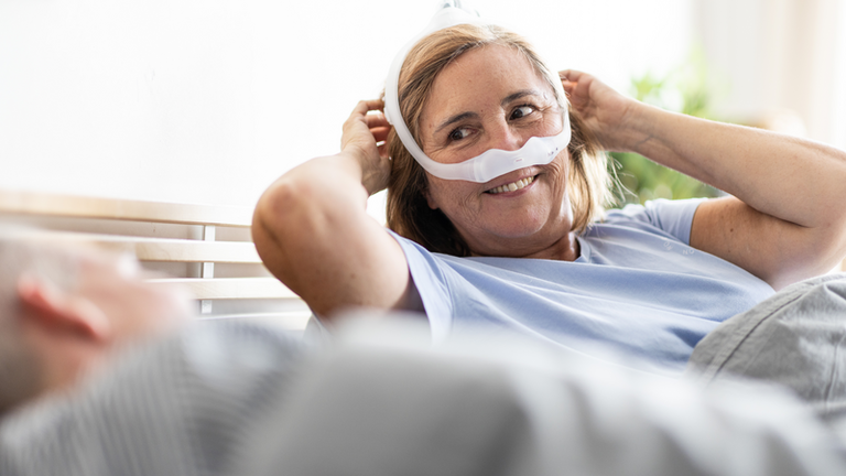 Obstructive sleep apnea in adults - patient waking up (female)